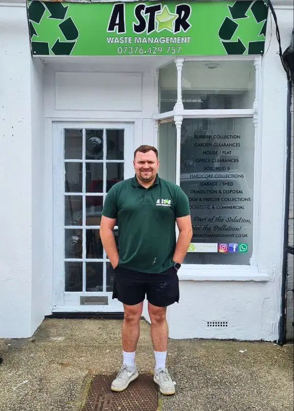 Jordan standing outside the A Star Waste Management office in Worthing