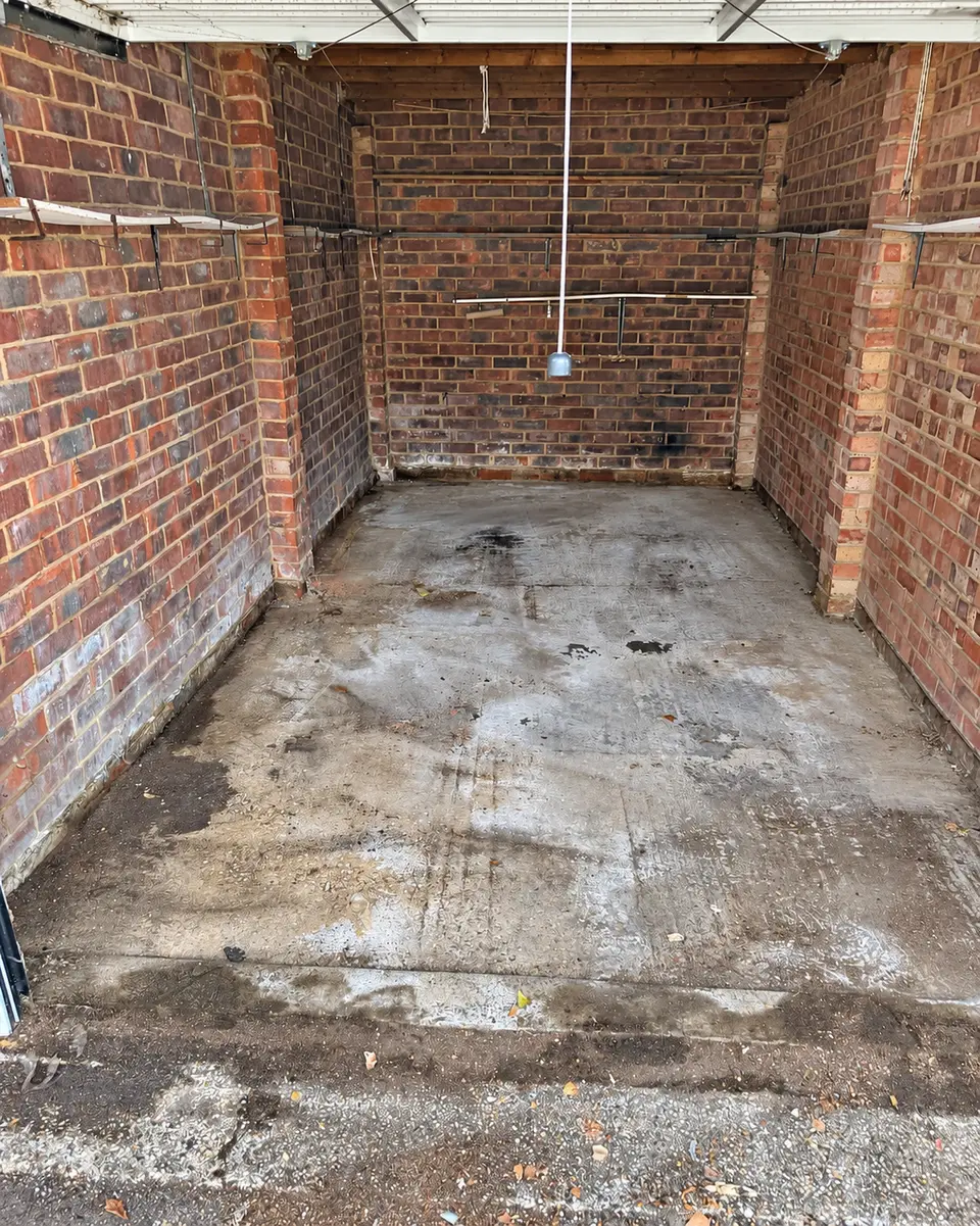 After: the garage emptied to the concrete floor