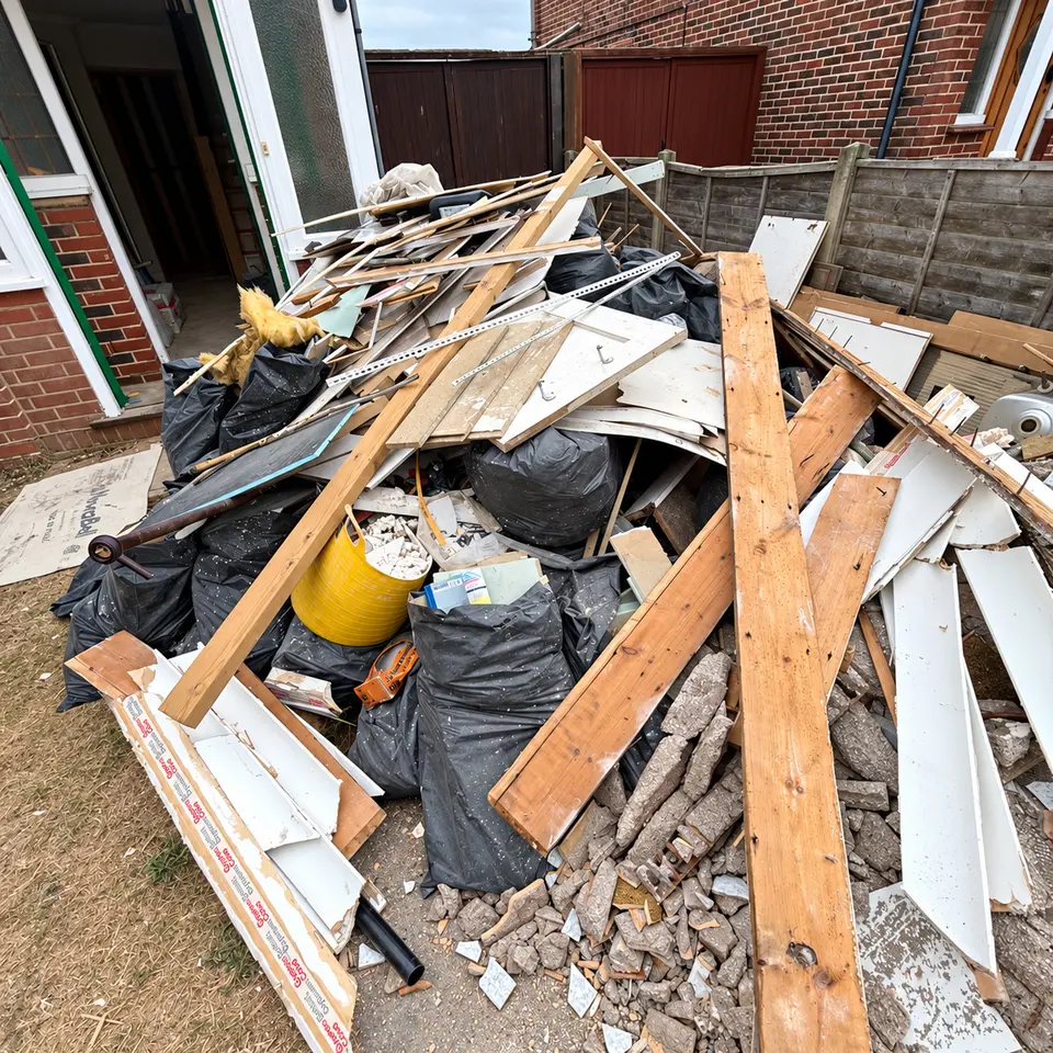 A large pile of renovation timber, plastic and rubble outside a front door